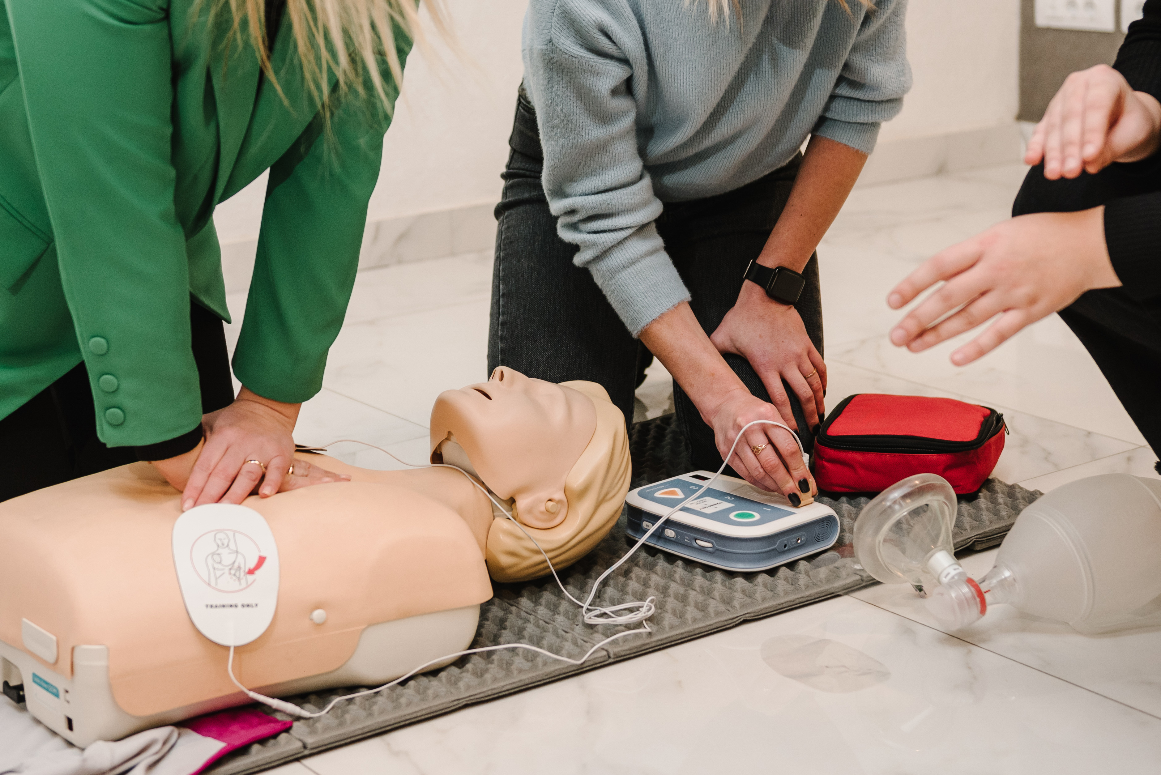 Students with a training dummy