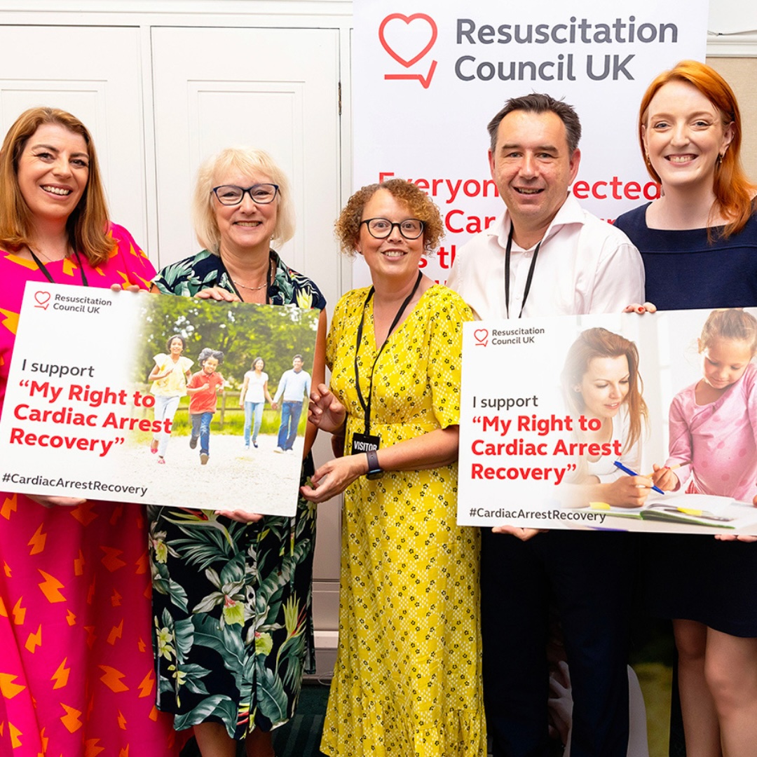 people holding up signs advocating for the my right to cardiac arrest recovery campaign
