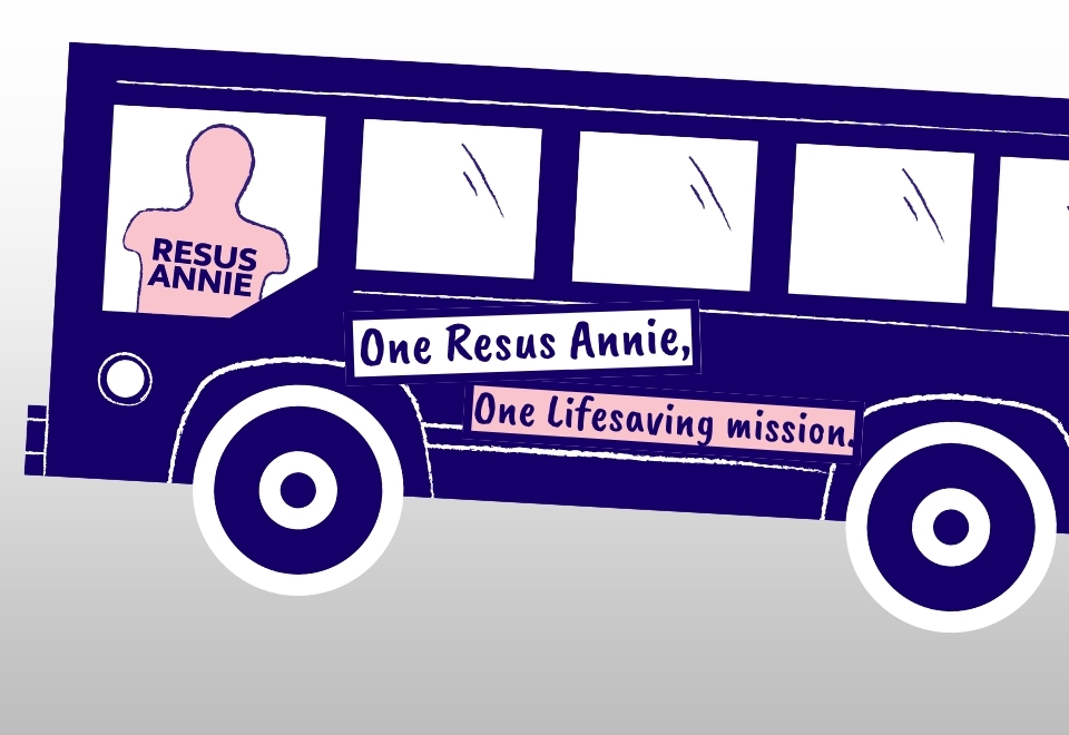 Resus Annie manikin on a bus with a slogan reading "One Resus Annie, one lifesaving mission"