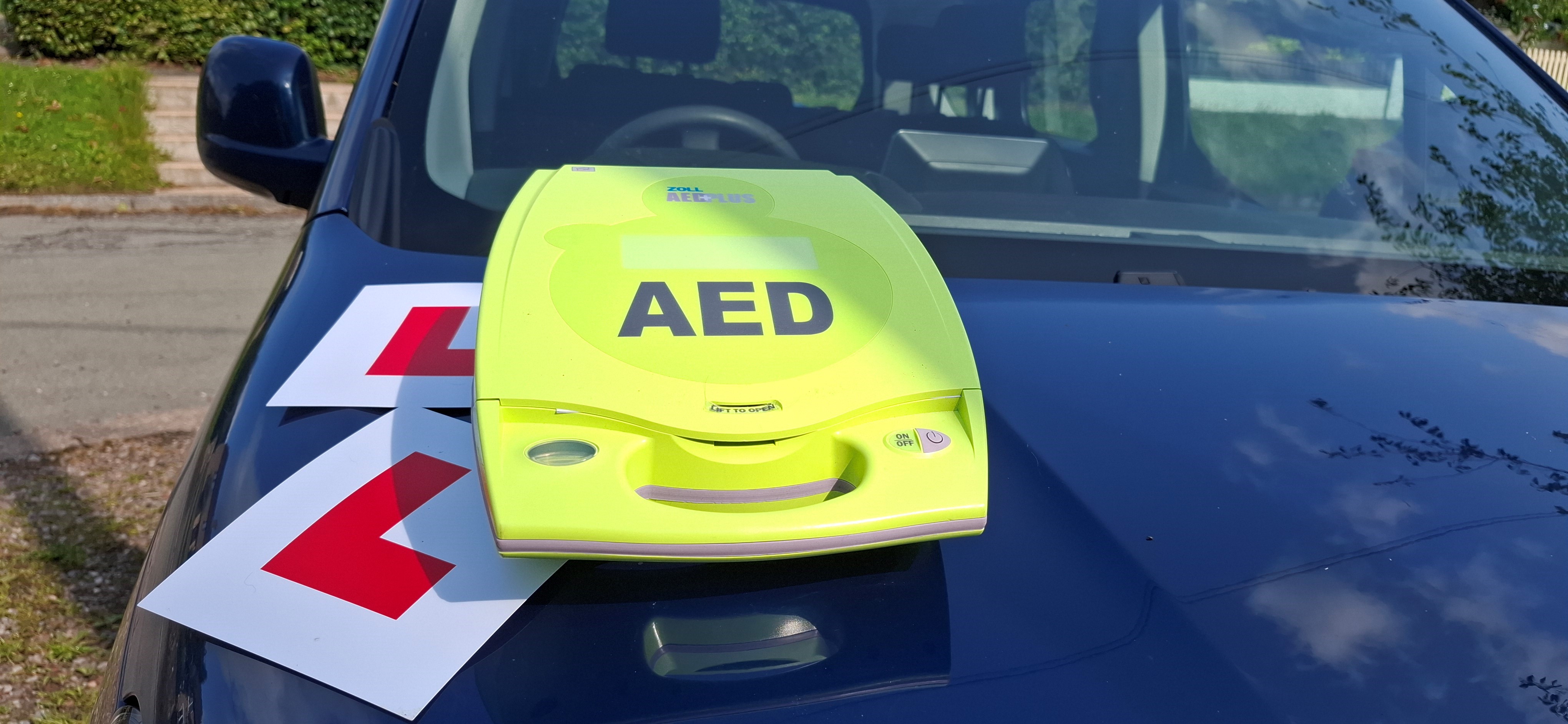 AED on car with learner plates