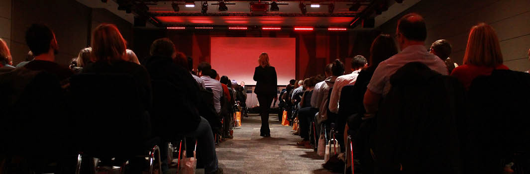 Event with speaker walking up towards the stage