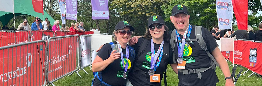 Family friend Kate, daughter Sophie, and James at the finish line of the Jurassic Coast Ultra Challenge