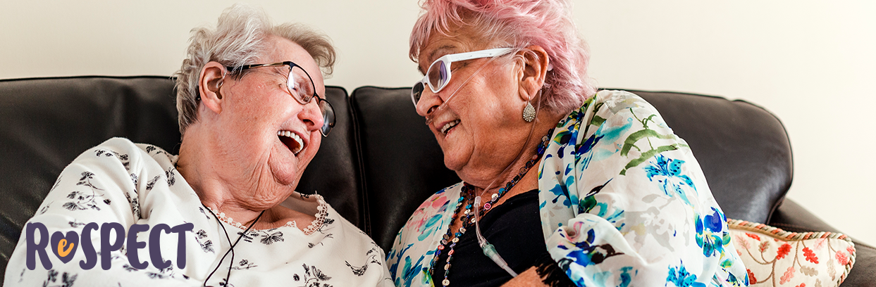 Two women laughing together