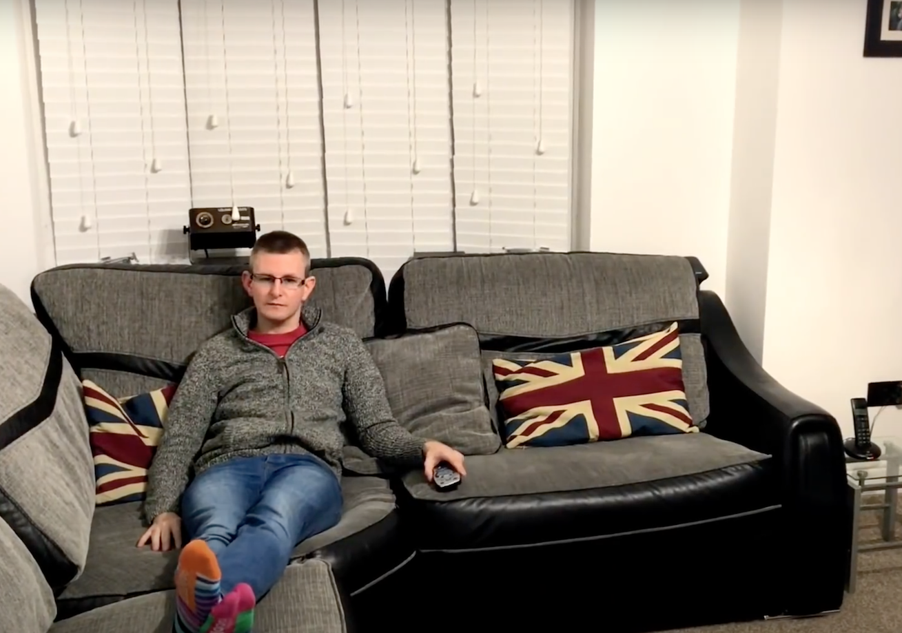 Tony (Paramedic) pictured sitting at home on his sofa thinking about the paediatric patient in traumatic cardiac arrest.