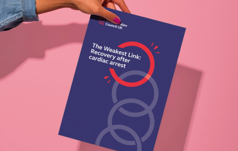 person holding a copy of The Weakest Link report against a pink background