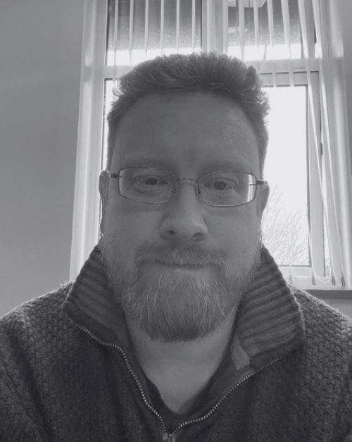 black and white headshot of Dr Rob Tinnion