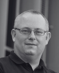 black and white headshot of Keith Couper