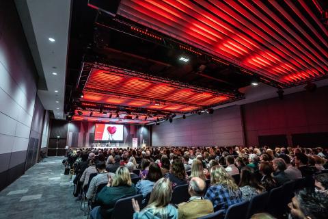 Group of individuals in seats at a conference