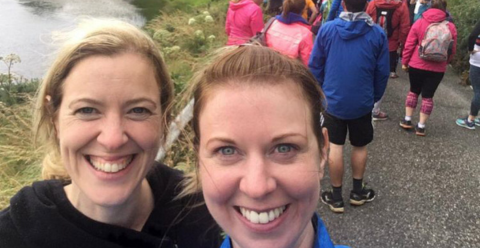 Michelle and friend smiling at running event 