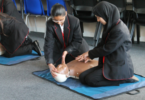 Students learning CPR