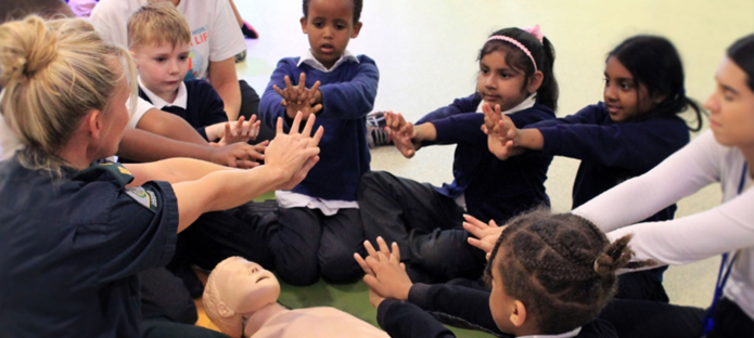 Children learning CPR