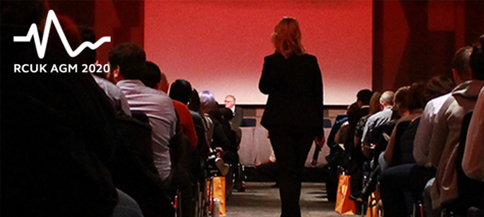 Photo from 2019 Conference, people sitting watching a presentation