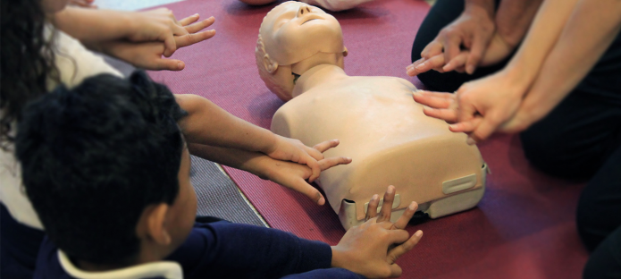 Children learning CPR
