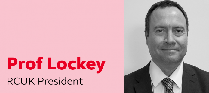 A black and white photo of RCUK President, Prof Lockey, smiling.